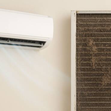 Can a dirty AC coil lead to system failure?