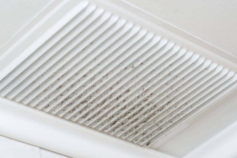 What are the common causes of poor airflow from my AC vents?